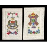 Three albums containing approximately 102 embroidered and woven silk postcards, many with regimental