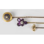 A Victorian gold, blue enamelled and half-pearl set stickpin, with a case, and two further gem set