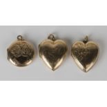 Two gold back and front heart shaped pendant lockets with engraved decoration, length of each 2.8cm,