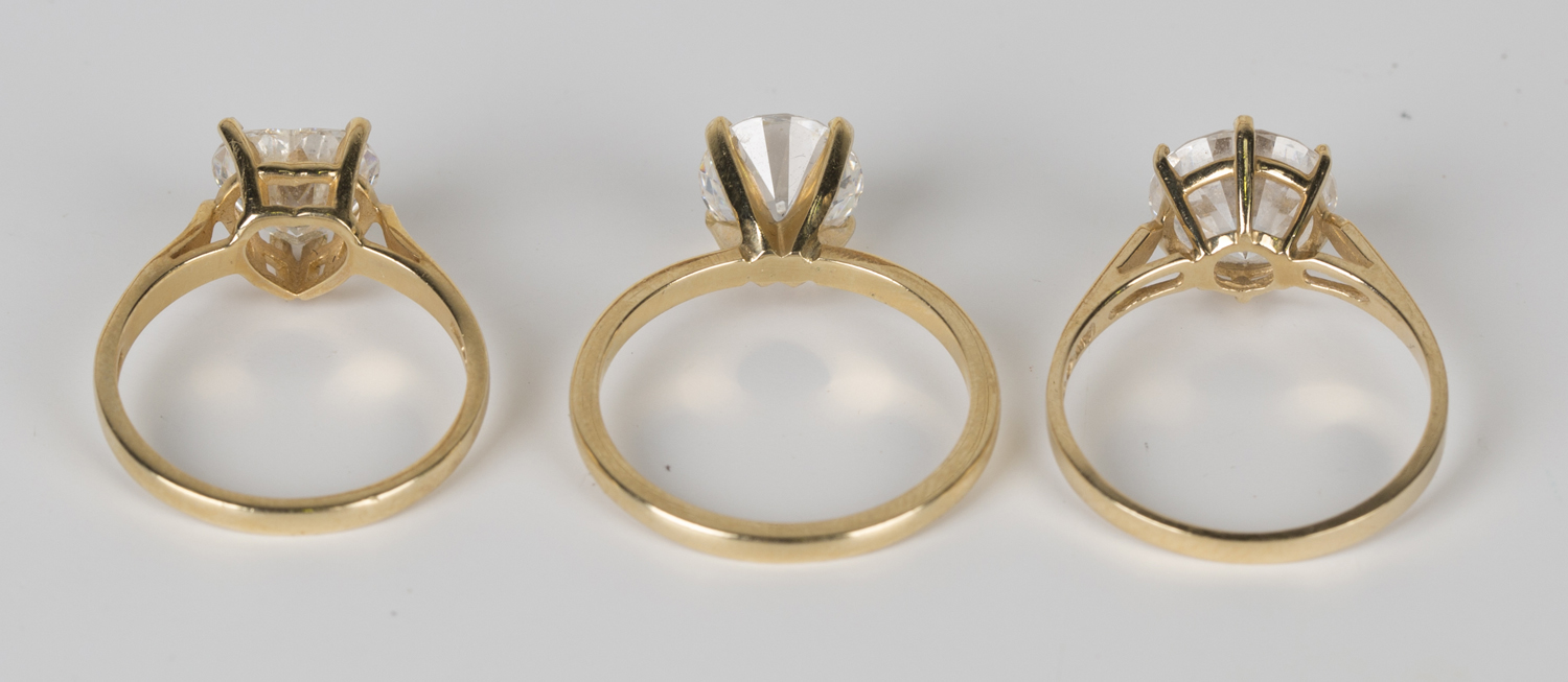 Three 14ct gold and colourless gem set solitaire rings with slight variations in design.Buyer’s - Image 2 of 2