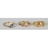 A gold, platinum and diamond set two stone ring in a cross-over design, detailed 'Plat 18ct', an