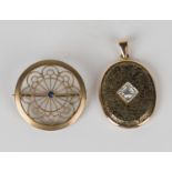 A German sapphire set single stone brooch, pierced in a circular wirework design, detailed '333',