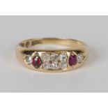A Victorian 18ct gold, diamond and red gem set ring, mounted with six cushion shaped diamonds to the