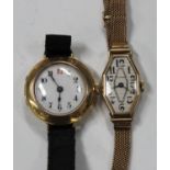 An 18ct gold circular cased lady's wristwatch with an unsigned jewelled movement, 18ct gold inner
