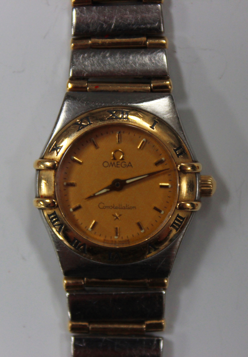 An Omega Constellation steel and gilt lady's bracelet wristwatch, the signed gilt dial with gilt