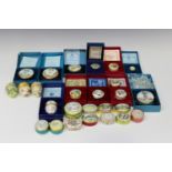 Twenty-six Halcyon Days enamel boxes, including five dated Christmas examples, three commemorating