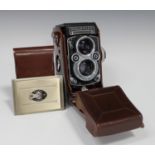 A Franke & Heidecke Rolleiflex 3.5F twin-lens reflex camera, serial number 2217082, circa 1959, with