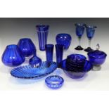 A collection of assorted blue glass, including a Nachtmann flashed vase of gently flared form, a