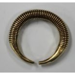 A gold ring money adornment, probably Bronze Age, of penannular form with ribbed decoration, width