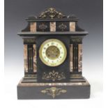 A Victorian slate mantel clock with eight day movement striking on a gong, the dial with Arabic