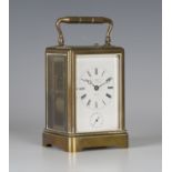 A late 19th/early 20th century French brass 'one-piece' cased carriage alarm clock with eight day