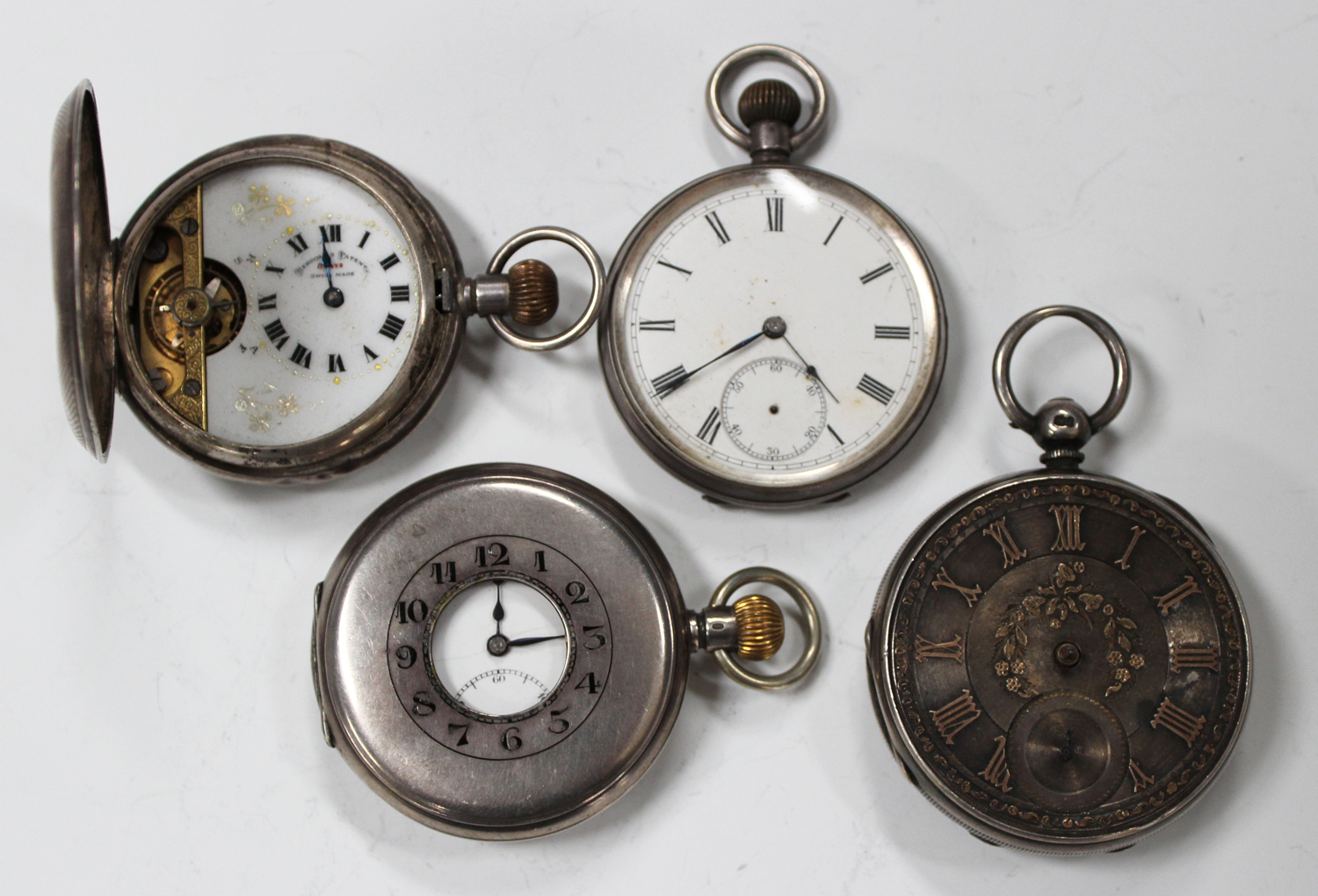 A silver cased keyless wind half-hunting cased gentleman's pocket watch with a jewelled lever