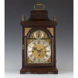 A George III mahogany bracket clock with eight day triple fusee movement chiming quarters on eight