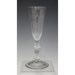 A faceted stem ale glass, late 18th century, the rounded funnel bowl with faceted base, raised on