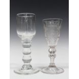 A bobbin stem wine glass, early 19th century, the rounded funnel bowl raised on a three-bobbin