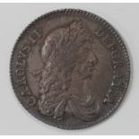 A Charles II milled issue Second Bust shilling 1668, with old ink-written collector's ticket.Buyer’s
