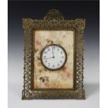 A Victorian brass and pottery easel timepiece, the drum cased movement with platform escapement, the