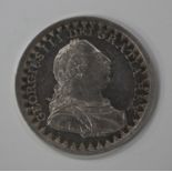 A George III three shilling bank token 1811.Buyer’s Premium 29.4% (including VAT @ 20%) of the