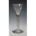 An airtwist stem wine glass, mid-18th century, the drawn trumpet bowl raised on a multi-series