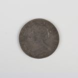 A Queen Anne Second Bust shilling 1703, detailed 'Vigo', with old ink-written collector's ticket.