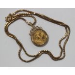 A South Africa one-tenth Krugerrand 1984 in a 9ct gold pendant mount with a 9ct gold box link