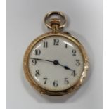 A gold cased keyless wind open-faced lady's fob watch with an unsigned gilt jewelled lever movement,