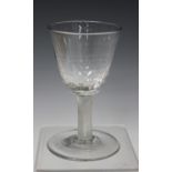 An incised twist stem wine glass, circa 1755-60, the dimpled rounded funnel bowl raised on an