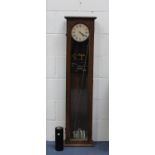 A Synchronome Electric master clock, the silvered circular dial with black Roman numerals and