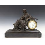 A late 19th century French spelter and slate mantel clock with eight day movement striking on a bell