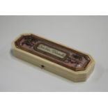 A late 18th century French ivory and rose gold mounted canted rectangular box, the glazed lid