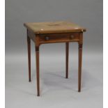 An Edwardian mahogany and satinwood crossbanded envelope card table, fitted with a drawer, raised on