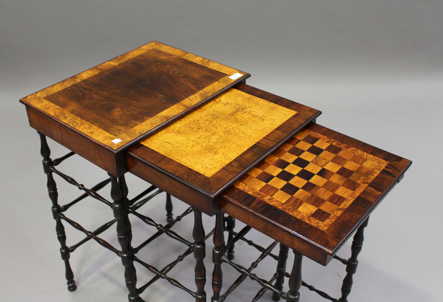 A mid-Victorian rosewood nest of three occasional tables, the largest table crossbanded in burr - Image 3 of 3