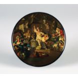 A Stobwasser circular papier-mâché snuff box, the lid finely painted with a bawdy scene of figures