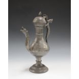 A Continental pewter tappit lidded ewer, possibly 18th century, the baluster body with scrolling