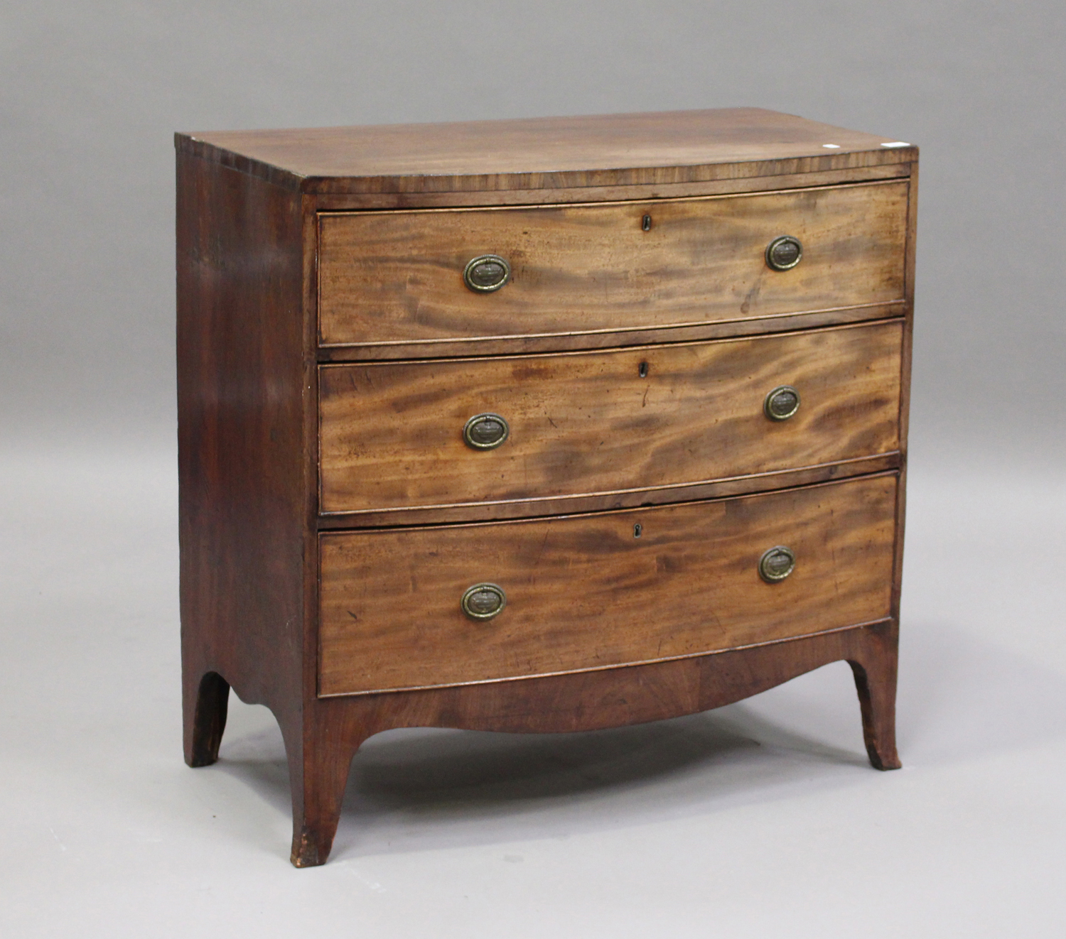 A Regency mahogany bowfront chest of three long drawers, on bracket feet, height 91cm, width 93cm,