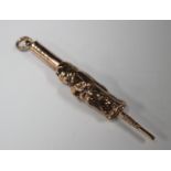 A late 19th century gold pendant fob novelty propelling pencil in the form of a standing monk,