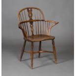 An unusual 19th century yew and elm Windsor armchair with pierced splat back, the outswept arms