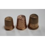 A 9ct gold thimble, 1933 by Charles Horner, together with two other thimbles.Buyer’s Premium 29.