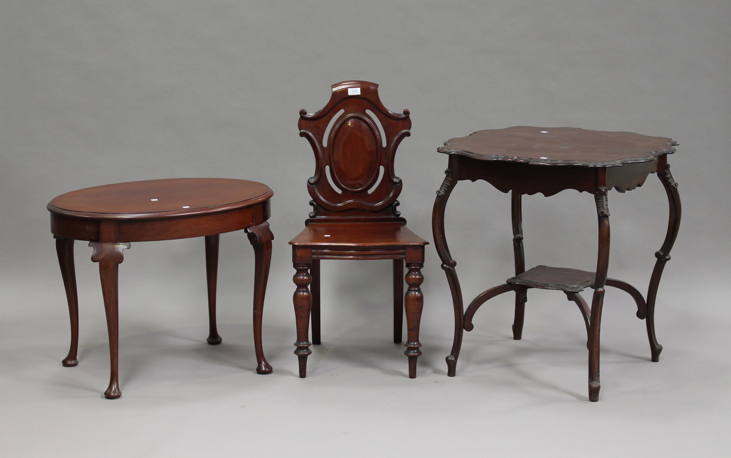 A Victorian mahogany hall chair with cartouche back and solid seat, height 68cm, width 43cm, an