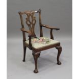 A late 19th/early 20th century George III Chippendale style mahogany elbow chair, the pierced splat