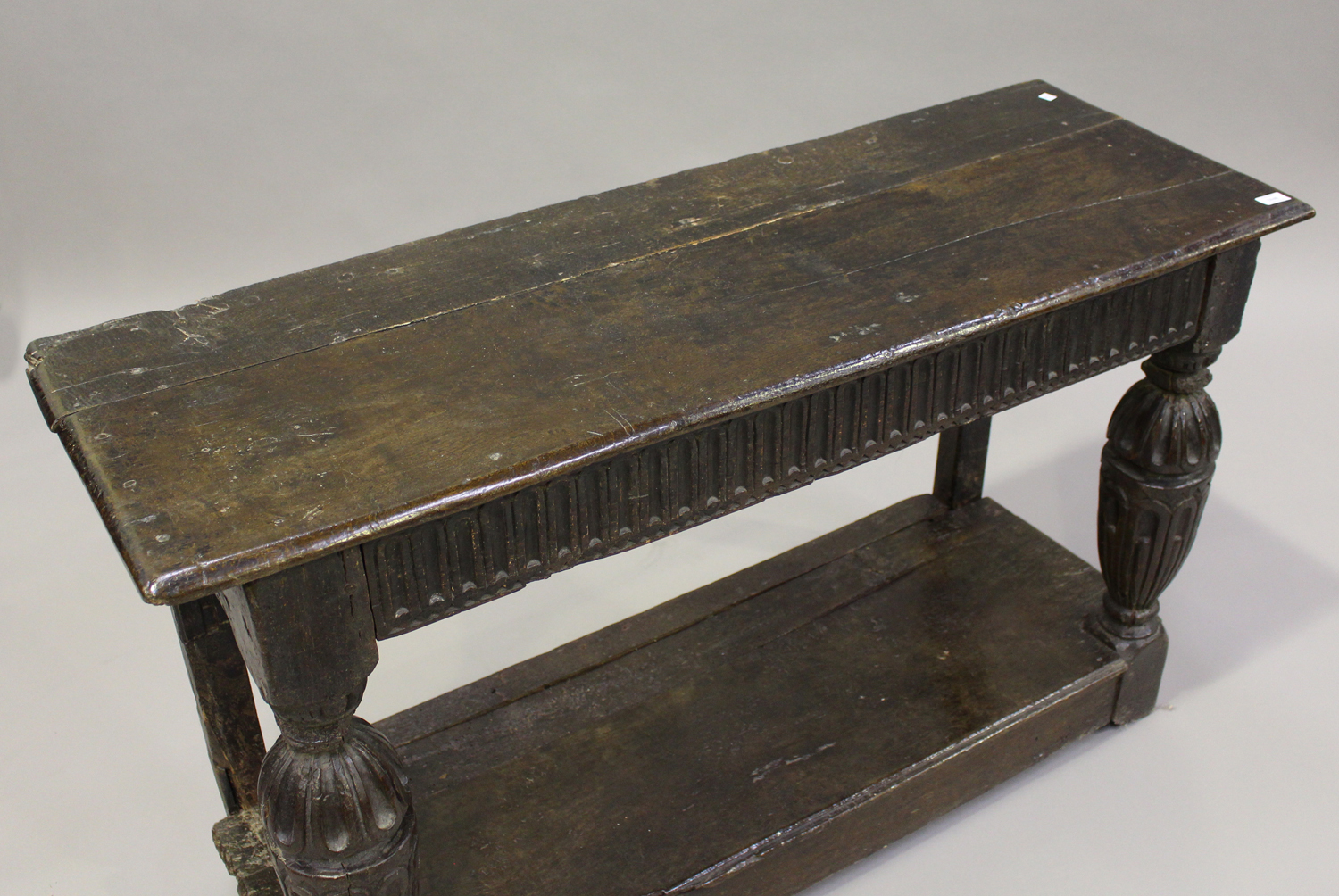 A 17th century and later oak console table, the rectangular top above a frieze with carved linenfold - Image 4 of 5