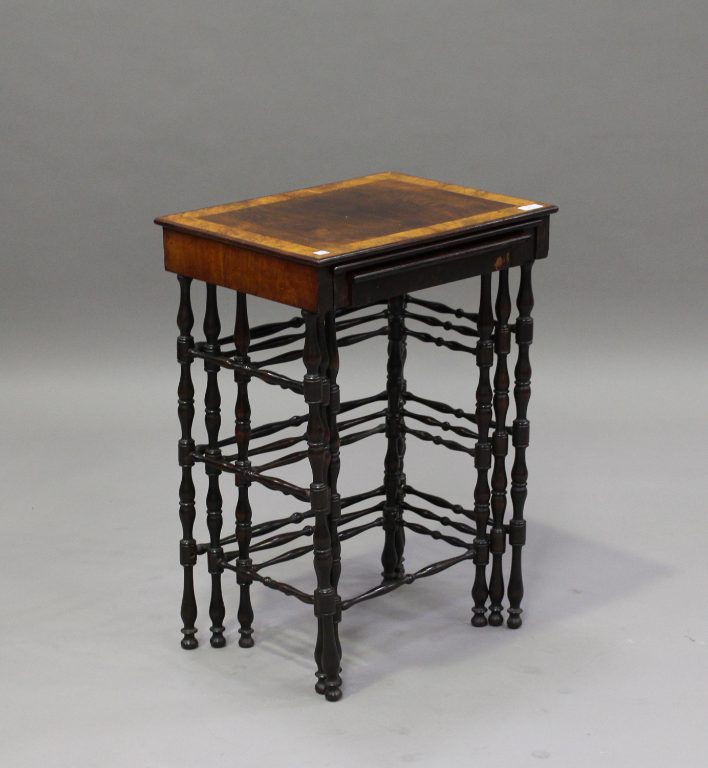 A mid-Victorian rosewood nest of three occasional tables, the largest table crossbanded in burr - Image 2 of 3