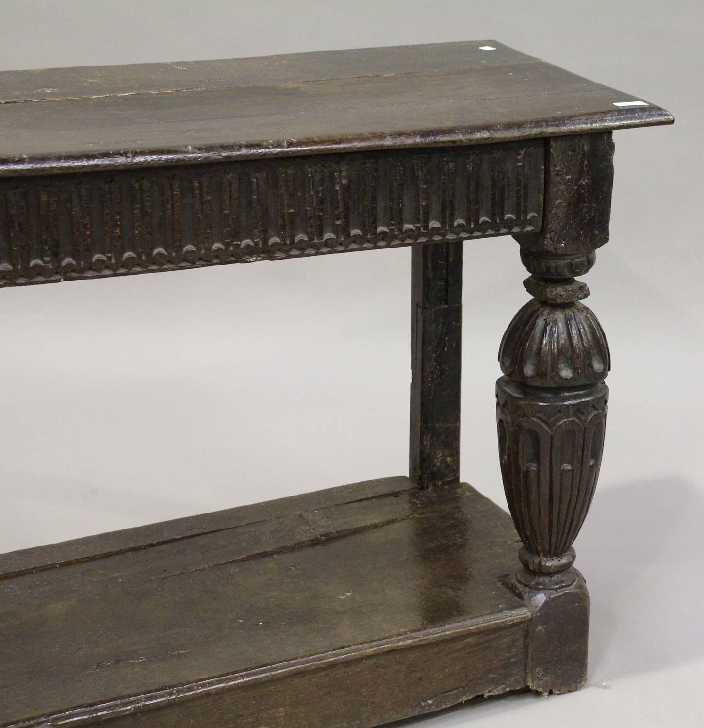 A 17th century and later oak console table, the rectangular top above a frieze with carved linenfold - Image 5 of 5