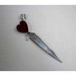 An early 20th century white metal and red enamelled bookmark, the heart shaped terminal fitted