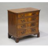 A 20th century reproduction mahogany chest of four graduated long drawers, on bracket feet, height