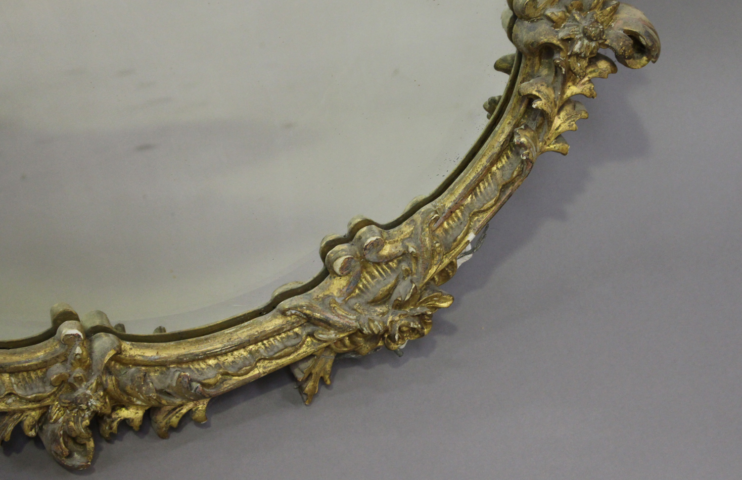 A 19th century giltwood and gesso circular wall mirror, decorated with floral scrolls, 80cm x 71cm. - Image 2 of 3