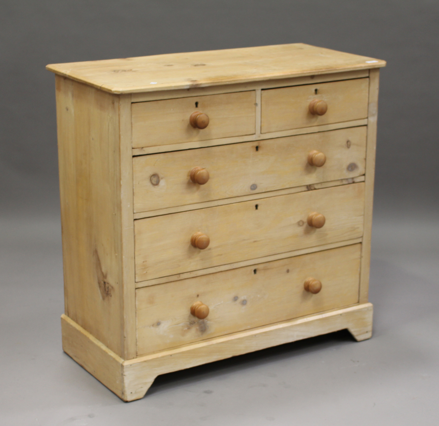 A 19th century pine chest of two short and two long drawers, raised on bracket feet, height 97cm,