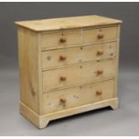 A 19th century pine chest of two short and two long drawers, raised on bracket feet, height 97cm,