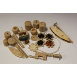 A group of mainly 19th century Canton carved bone needlework accessories, including clamps, needle