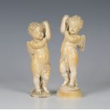 A pair of late 18th/early 19th century Continental carved ivory figures of standing cherubs,